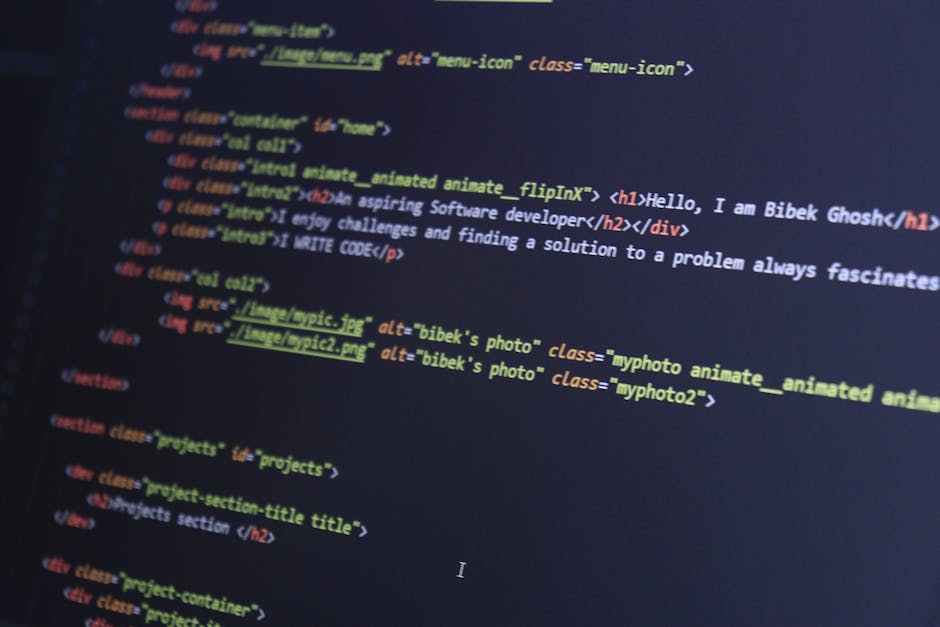 A close-up view of a person's hands using a laptop computer with a dark-themed code editor open on the screen, displaying lines of colour-coded programming code. The laptop is placed on a smooth, black surface, and the background is blurred, indicating an indoor setting with soft lighting. The scene suggests a focus on digital work, technology, or software development, with no direct connection to rubbish or waste management services but illustrating the use of electronic devices for administrative or planning tasks related to rubbish removal. The image captures the detailed texture of the person's skin and the sleek, silver finish of the laptop, providing a professional and neutral portrayal of working with technology in a work or home environment.