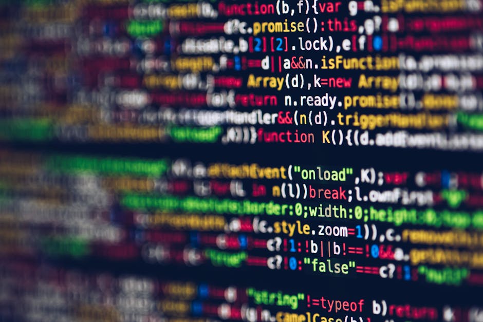 A close-up photograph of a computer screen displaying lines of colorful programming code, including keywords, functions, variables, and syntax in various colors such as red, green, blue, yellow, and white against a dark background. The code appears slightly blurred, emphasizing the visual complexity and technical nature of programming. This image reflects the digital environment where web development and online content management occur, which are relevant to modern rubbish removal services' online presence and digital marketing. It visually signifies the technical expertise involved in managing waste removal websites like Rubbish Removal Kentish Town, ensuring accurate information about services such as rubbish clearance and private waste disposal is efficiently delivered online. The contextual focus on coding underlines the importance of a well-managed digital platform for service providers involved in waste management, supporting the idea of alternative waste handling methods through professional web-based solutions.